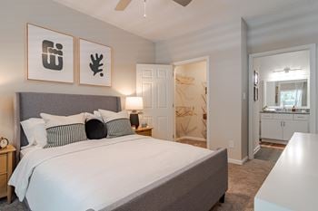 Primary bedroom at willowest in vinings apartments in atlanta, ga 30339